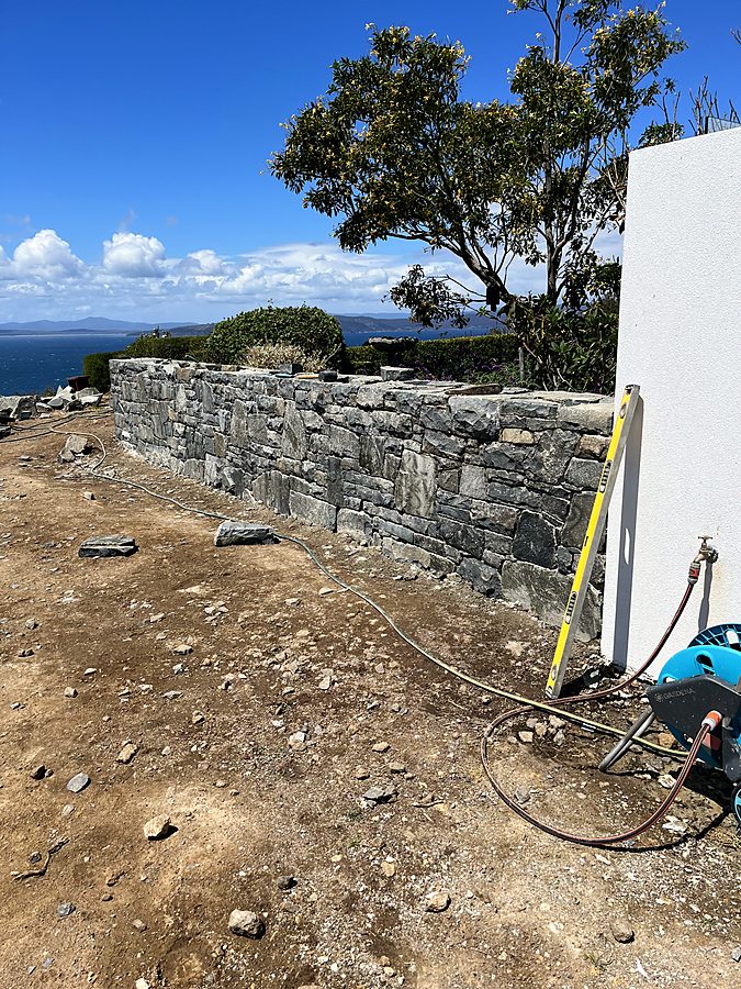 Dry stone wall on a coastal headland overlooking the water