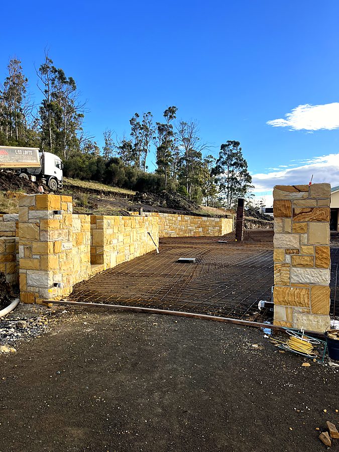 Sandstone retaining walls forming a vehicle entrance