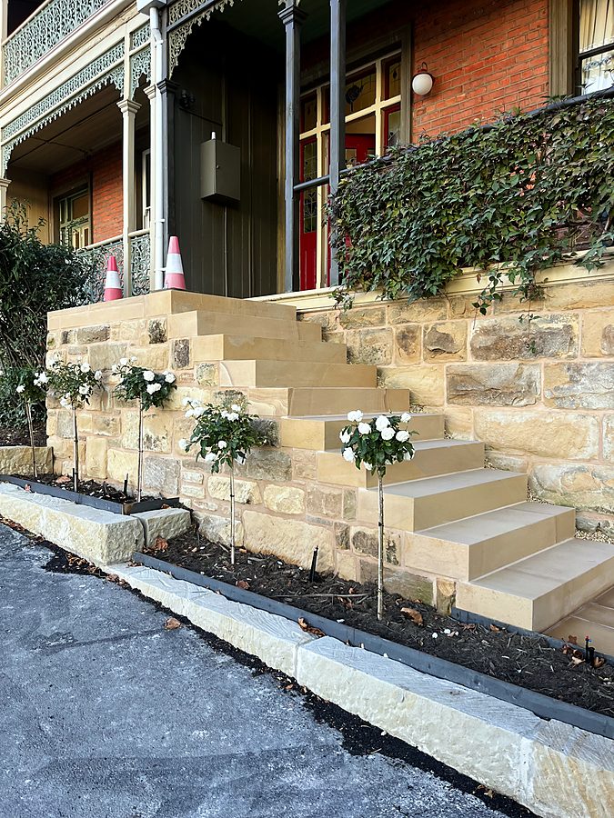 Solid sandstone steps and wall fronting a Victorian terrace