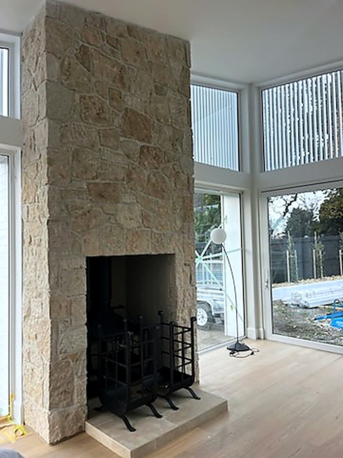 Stone fireplace and hearth in a new build